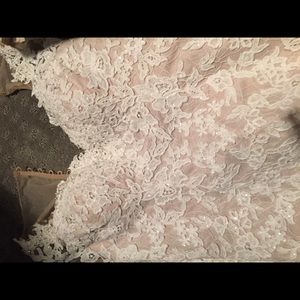 Beautiful wedding dress. It’s preserved in a box.